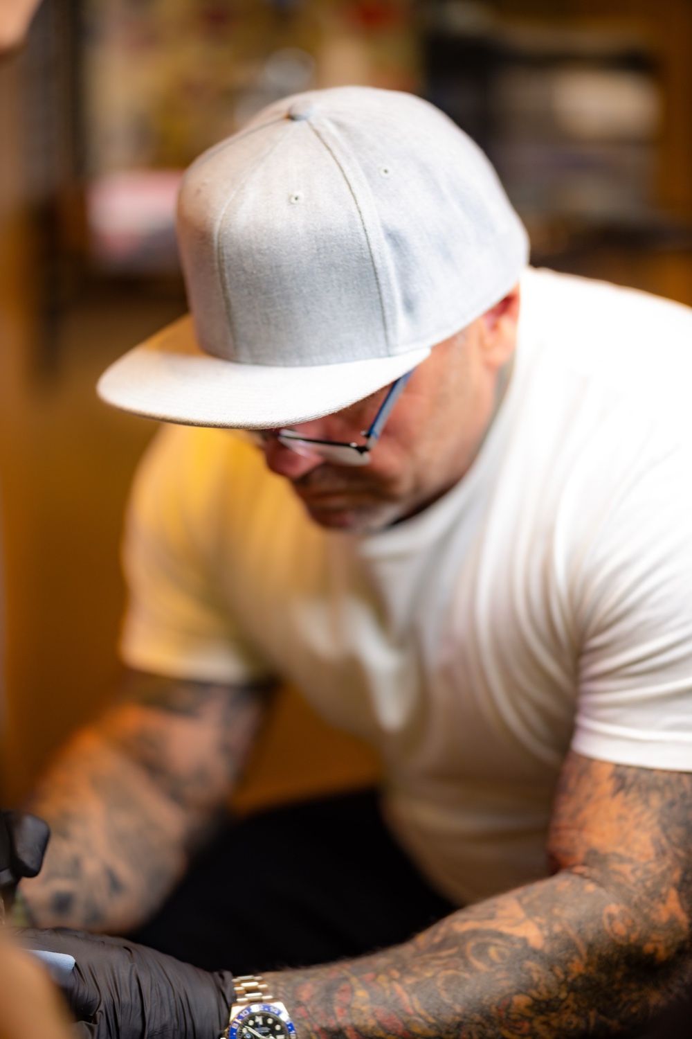 Tim Goodrich tattooing at Wailana Tattoo — American Traditional artist, Aloha Tattoo founder, Waikiki, Hawaii